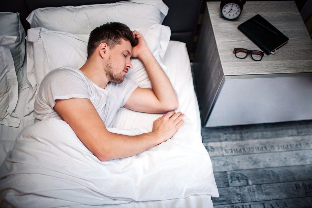 Man sleeping in bed